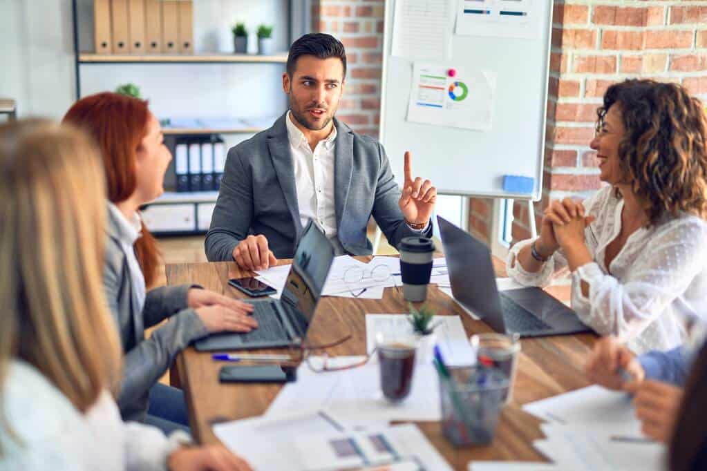 Team participating in workplace active break program with professional facilitator